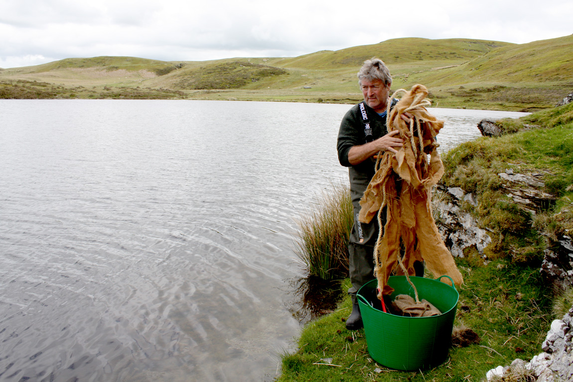 Peter Whipp of the Wild Carp trust gets ready to lay out the spawning substrates